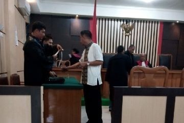 Kepala BPN Tebo, Hasnadi, usai menjalani sidang agenda vonis
